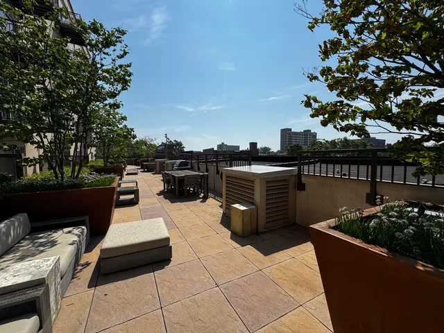 a view of a balcony with chairs