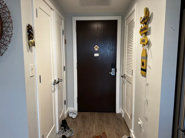 a kitchen with stainless steel appliances kitchen island granite countertop a sink stove and refrigerator