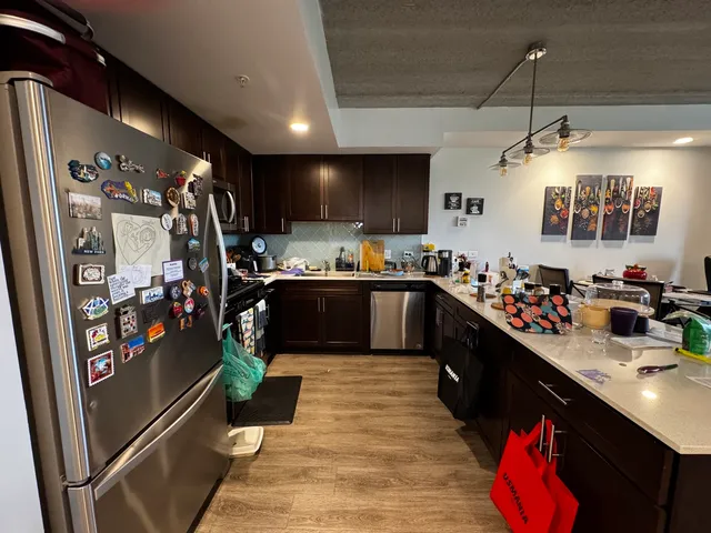 a kitchen with a sink cabinets and window