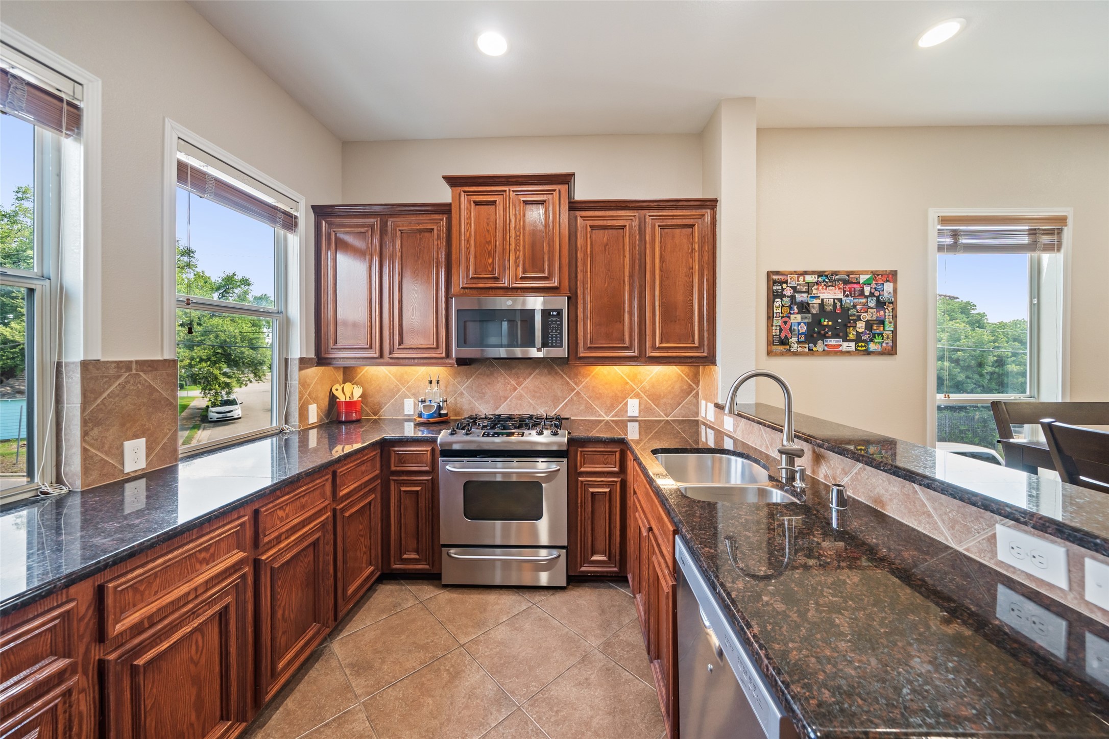 2613 Link Road Houston, TX 77009 - Photo 17 of 28 The kitchen offers real Mahogany cabinets, granite counters, and stainless steel appliances. Not pictured is a very spacious walk-in pantry.