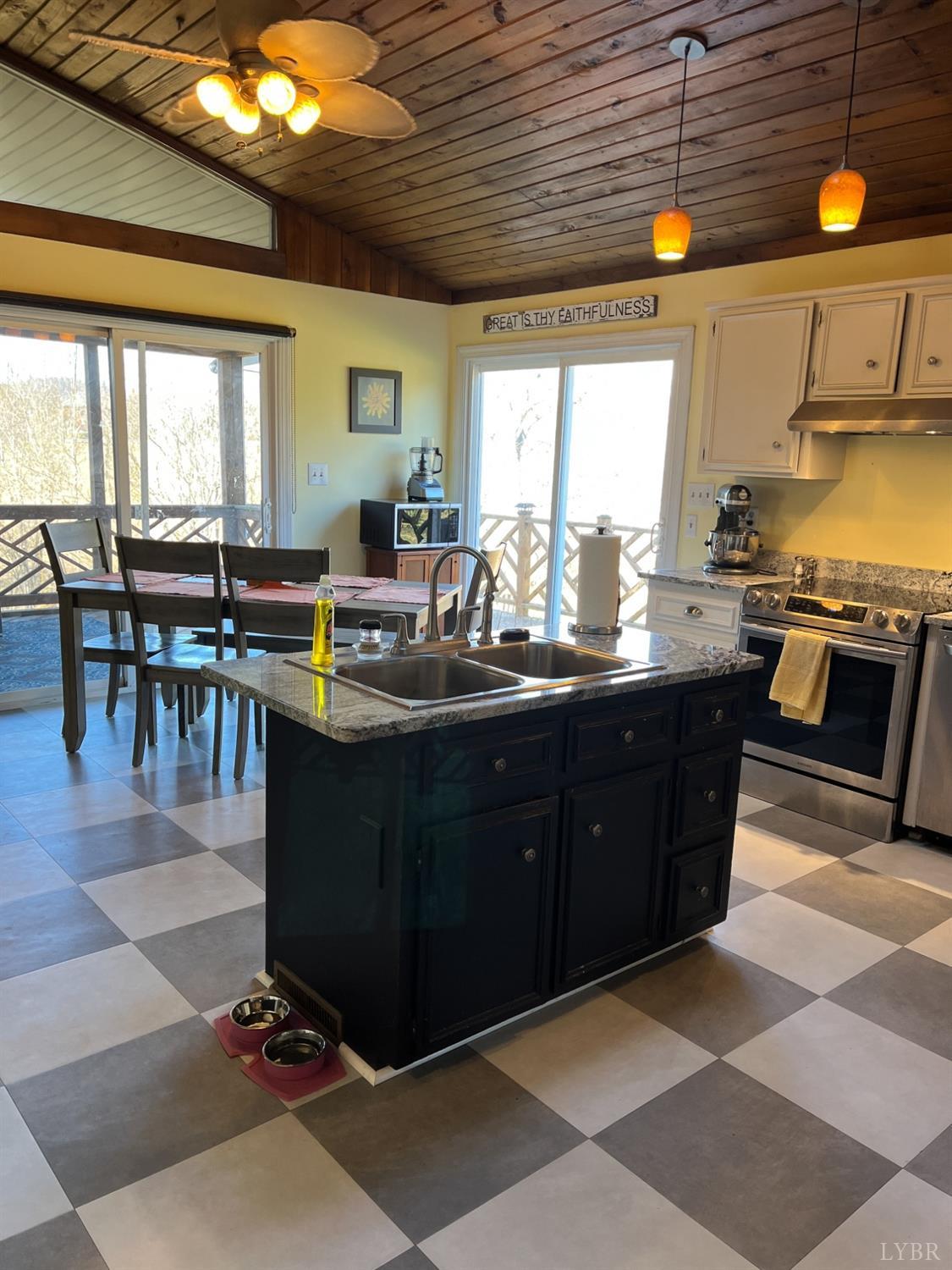 9710 Forest Road Goode, VA 24556 - Photo 13 of 49 a kitchen with lots of counter top space