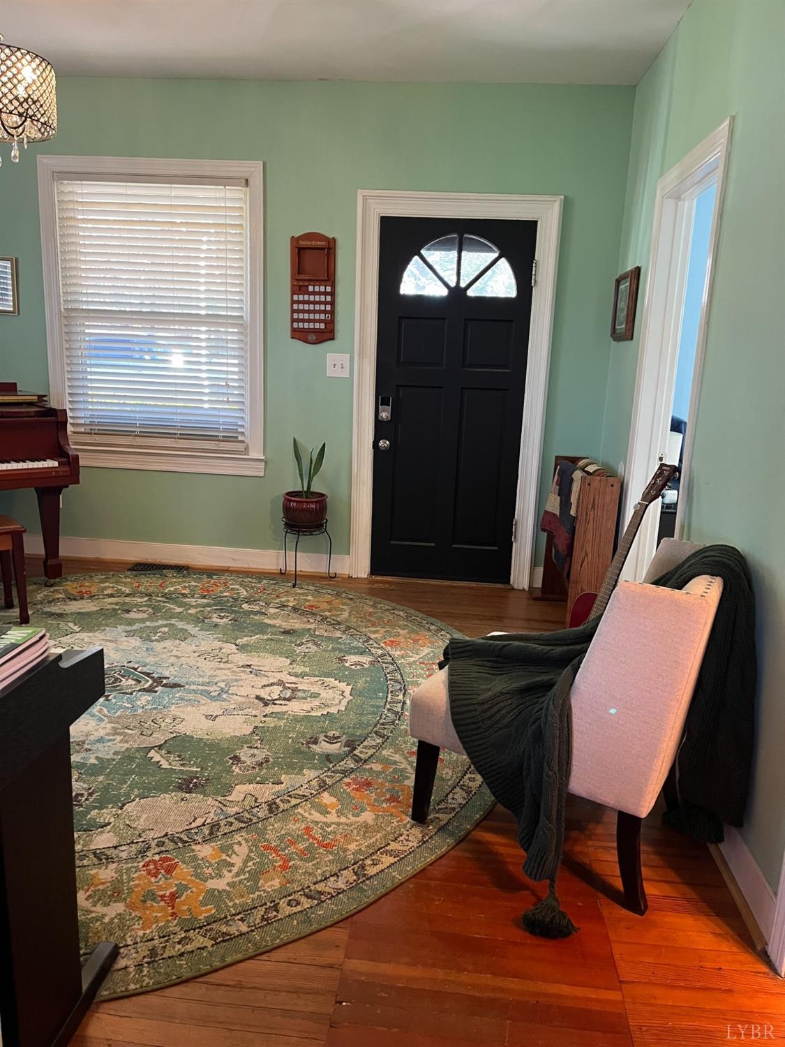 9710 Forest Road Goode, VA 24556 - Photo 3 of 49 a bedroom with a bed window and chair
