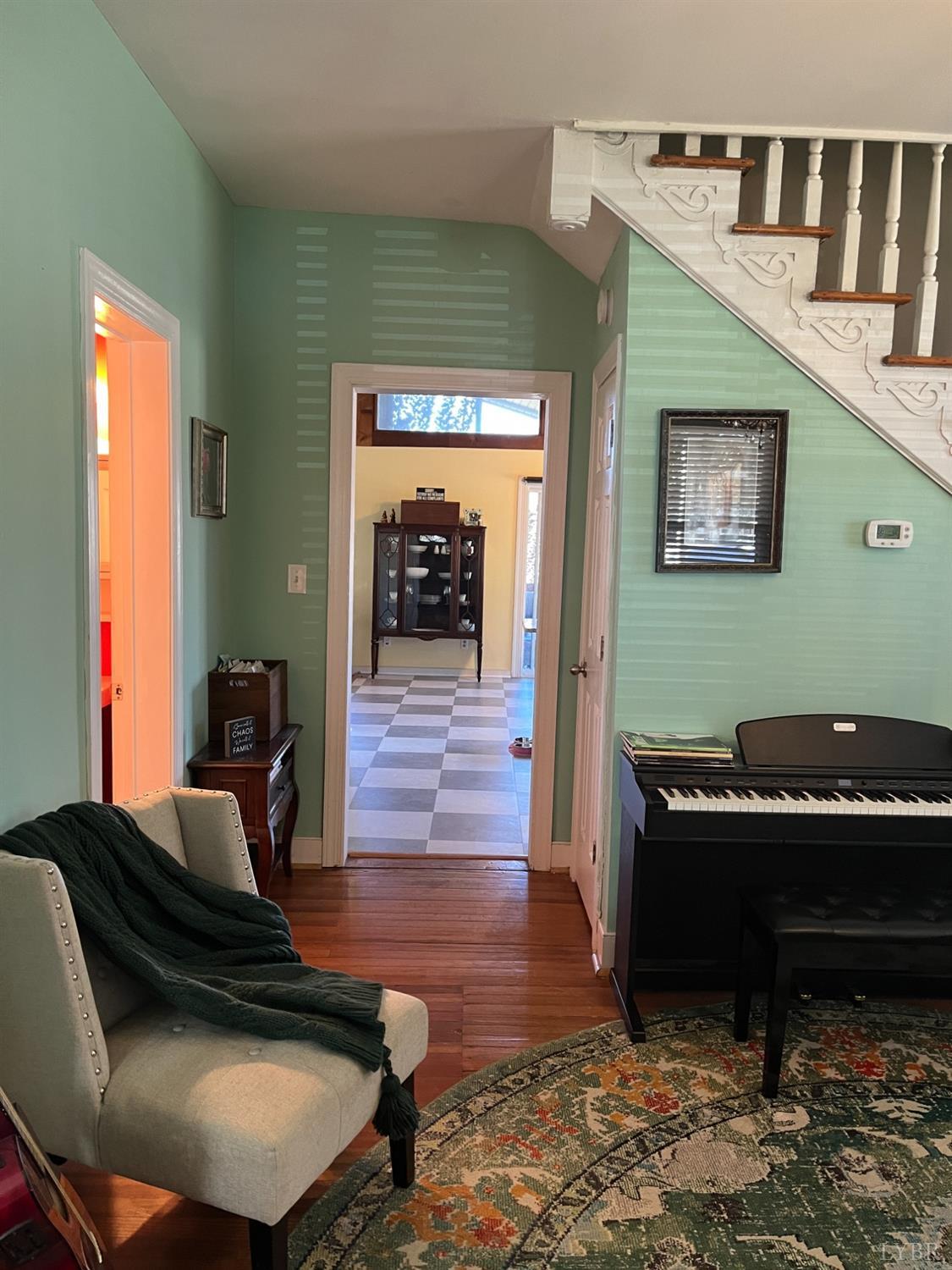 9710 Forest Road Goode, VA 24556 - Photo 4 of 49 a living room with furniture and a piano
