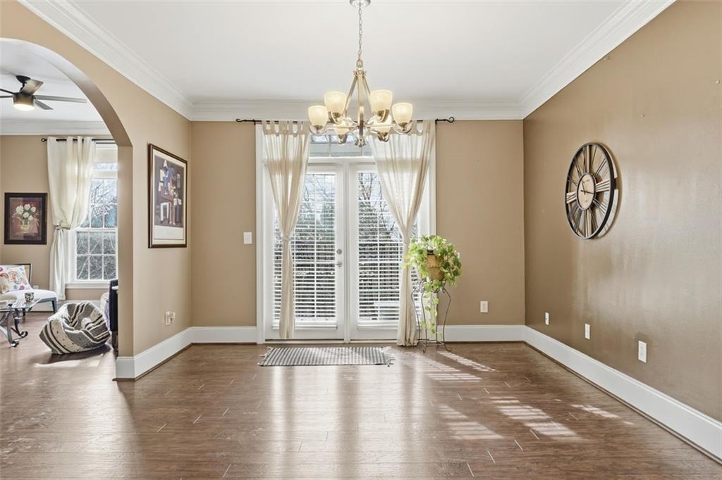 4100 Paces Walk Southeast, Unit 1303 Atlanta, GA 30339 - Photo 1 of 1 a view of an empty room with wooden floor and windows