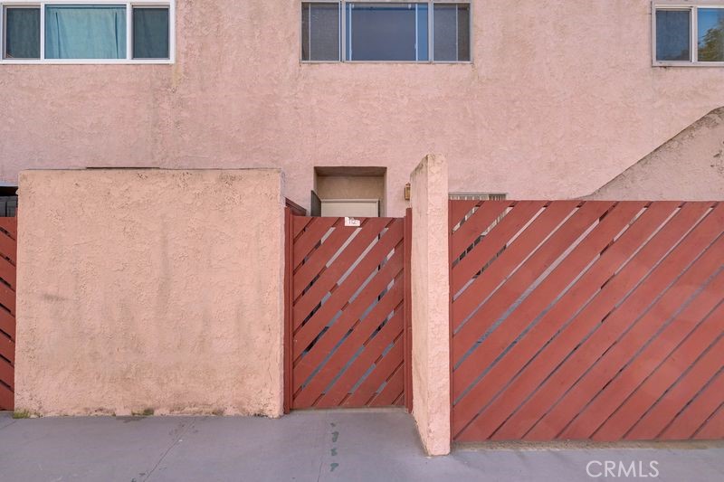 a view of a door and wooden floor