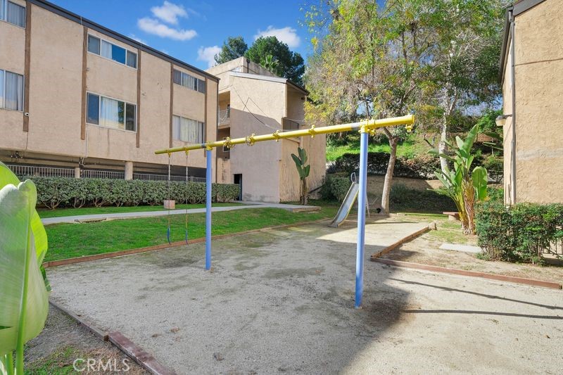 1781 Neil Armstrong Street, Unit 112 Montebello, CA 90640 - Photo 18 of 19 a view of a house with a backyard