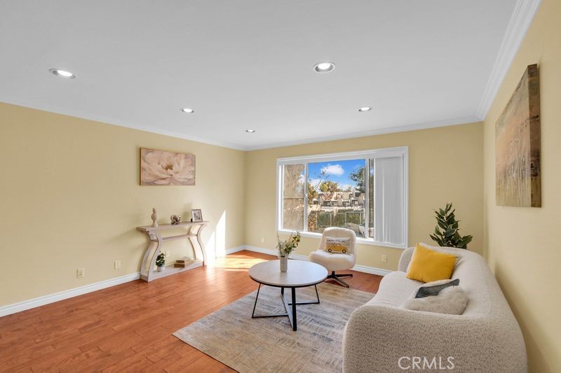 1781 Neil Armstrong Street, Unit 112 Montebello, CA 90640 - Photo 3 of 19 a living room with furniture and a large window