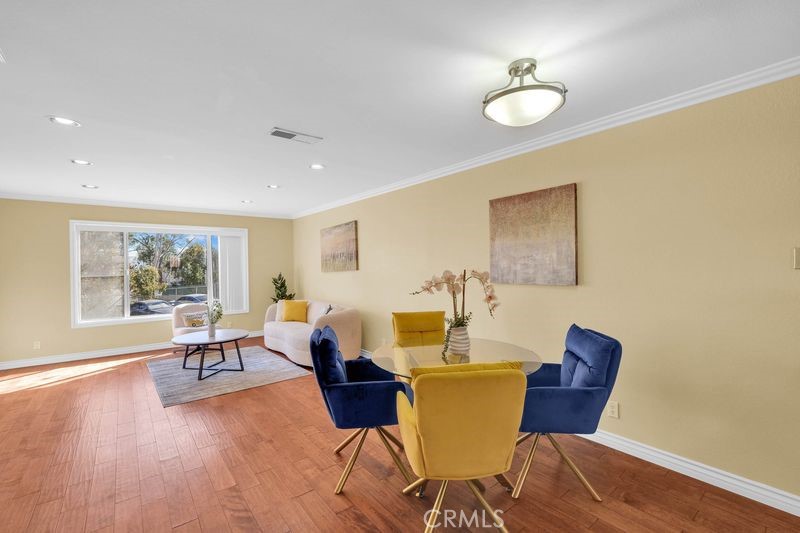 1781 Neil Armstrong Street, Unit 112 Montebello, CA 90640 - Photo 4 of 19 a living room with furniture and a large window