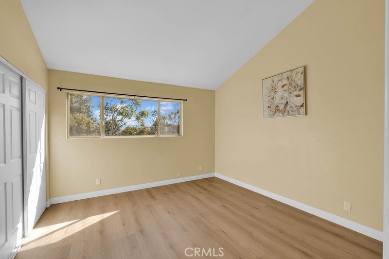 1781 Neil Armstrong Street, Unit 112 Montebello, CA 90640 - Photo 7 of 19 an empty room with a window and a painting on the wall