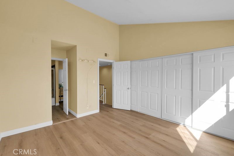 1781 Neil Armstrong Street, Unit 112 Montebello, CA 90640 - Photo 8 of 19 a view of an empty room and wooden floor