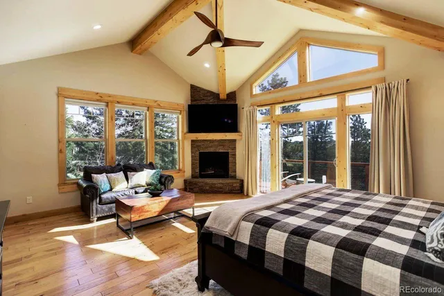 a bedroom with a bed and a fireplace