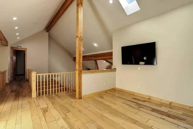 a view of a livingroom with a flat screen tv