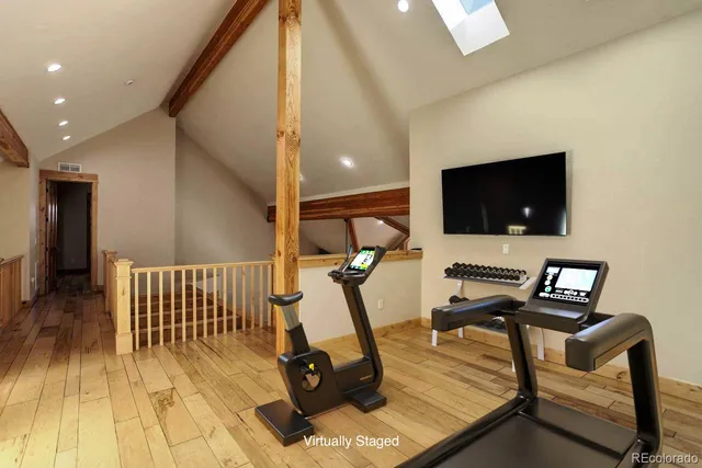 a view of a livingroom with furniture and a flat screen tv
