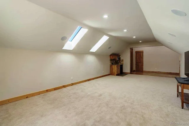 an empty room with gym equipment and white walls