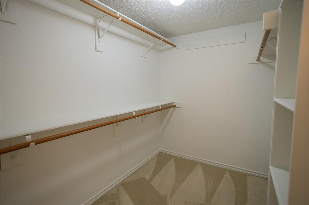 809 Sterling Court Allen, TX 75002 - Photo 2 of 16 a view of a room with racks on the wall