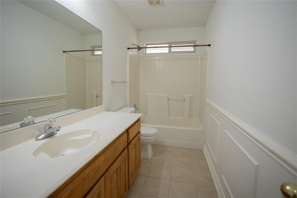 809 Sterling Court Allen, TX 75002 - Photo 6 of 16 a bathroom with a sink a toilet and shower