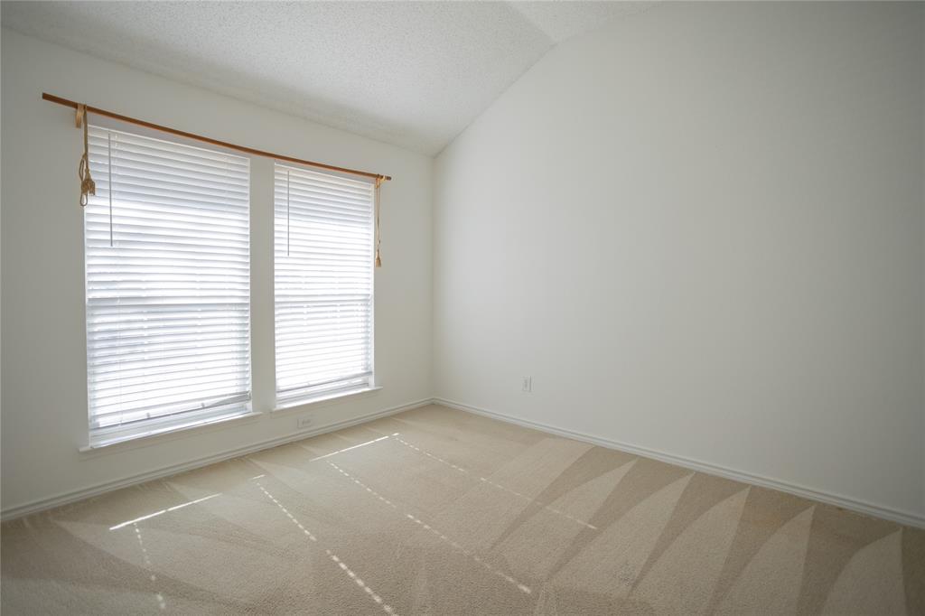 809 Sterling Court Allen, TX 75002 - Photo 7 of 16 a view of an empty room with a window