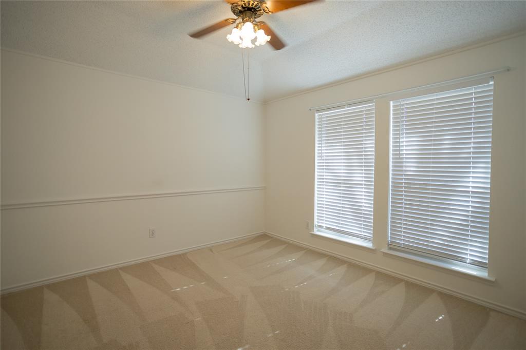 809 Sterling Court Allen, TX 75002 - Photo 9 of 16 an empty room with a window