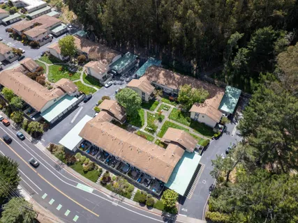 an aerial view of a house with a garden