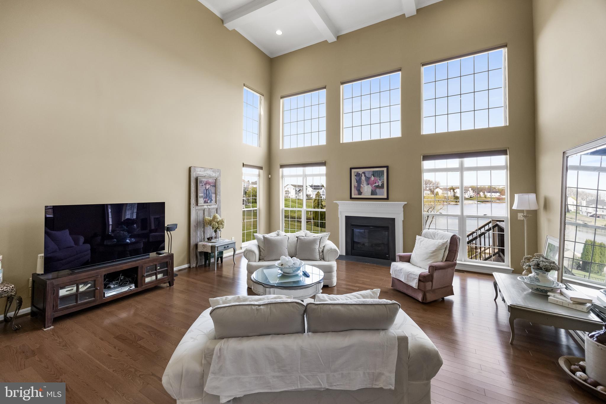 23 Mullen Drive Sicklerville, NJ 08081 - Photo 11 of 73 a living room with furniture a flat screen tv and a large window