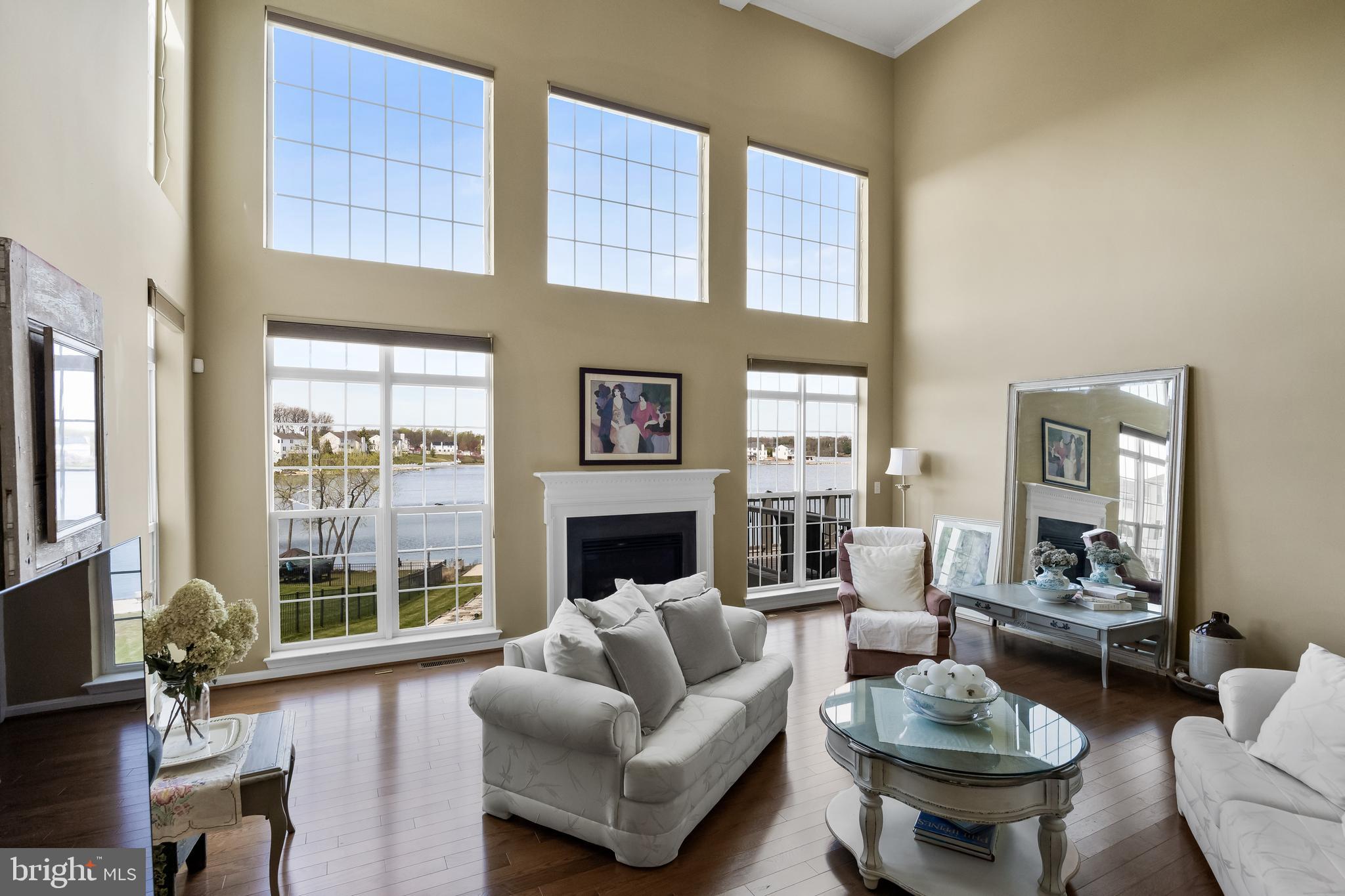 23 Mullen Drive Sicklerville, NJ 08081 - Photo 12 of 73 a living room with furniture a fireplace and large windows