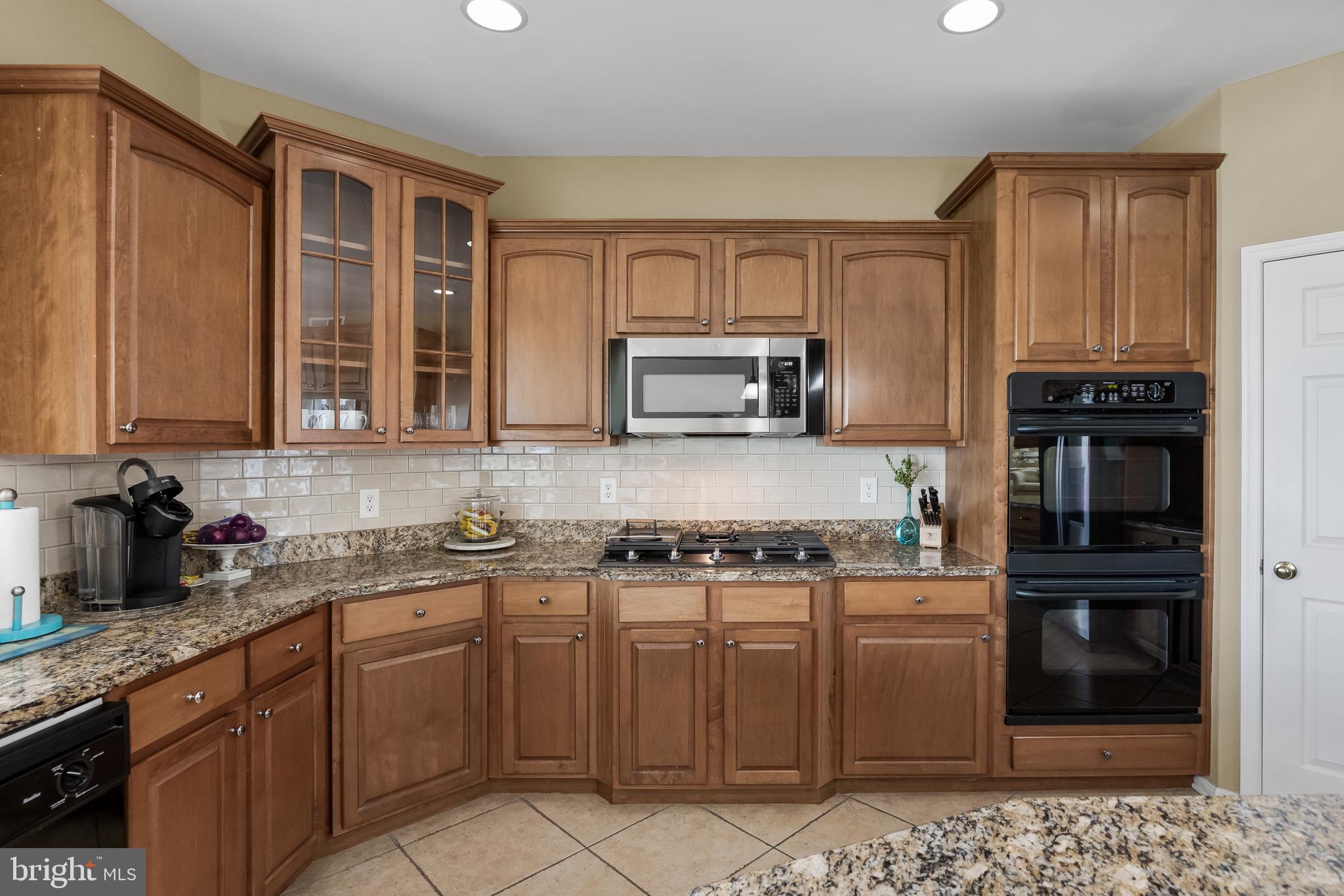 23 Mullen Drive Sicklerville, NJ 08081 - Photo 20 of 73 a kitchen with stainless steel appliances granite countertop a stove a sink and a microwave