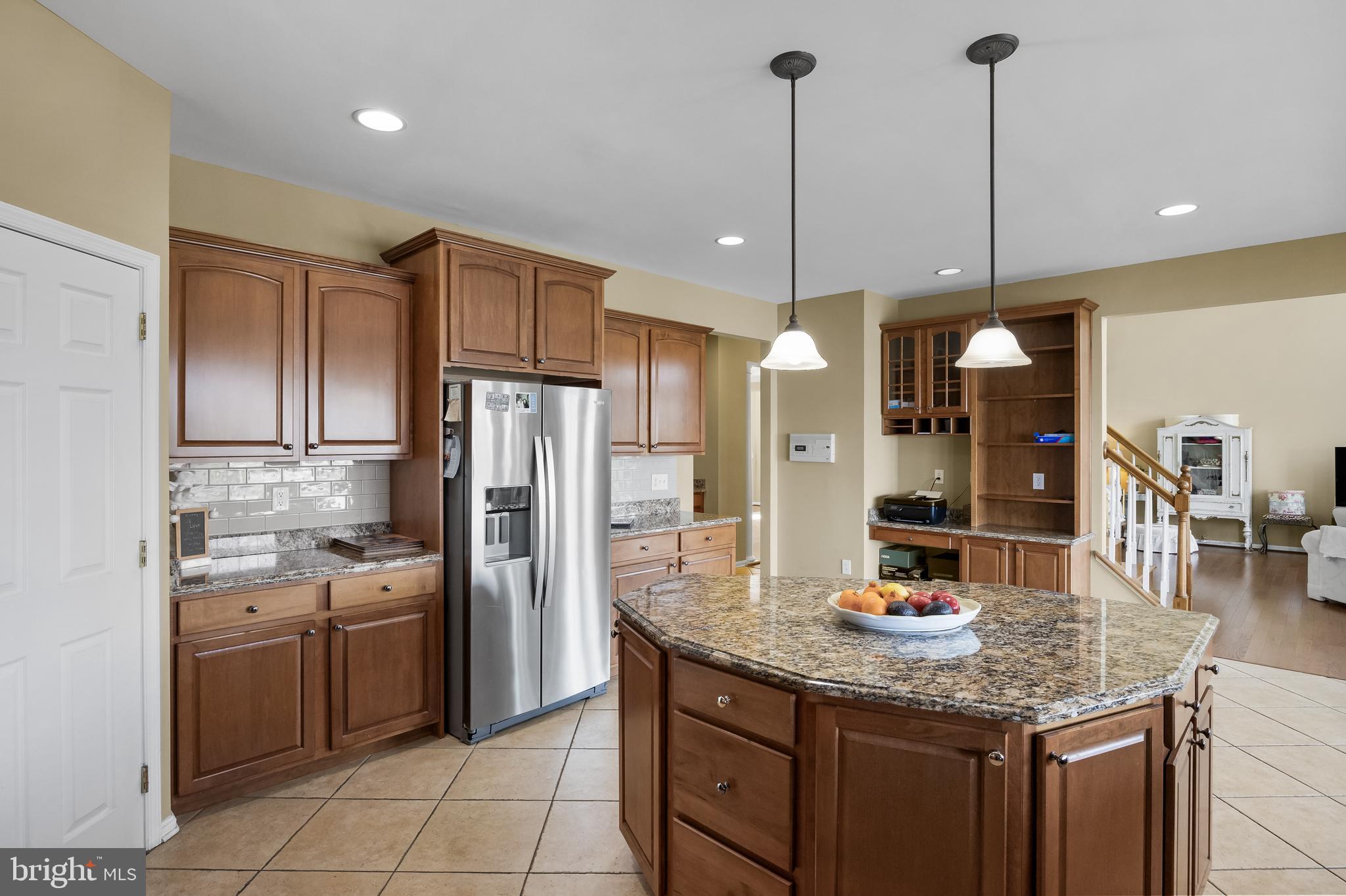 23 Mullen Drive Sicklerville, NJ 08081 - Photo 21 of 73 a kitchen with stainless steel appliances granite countertop a sink refrigerator and cabinets