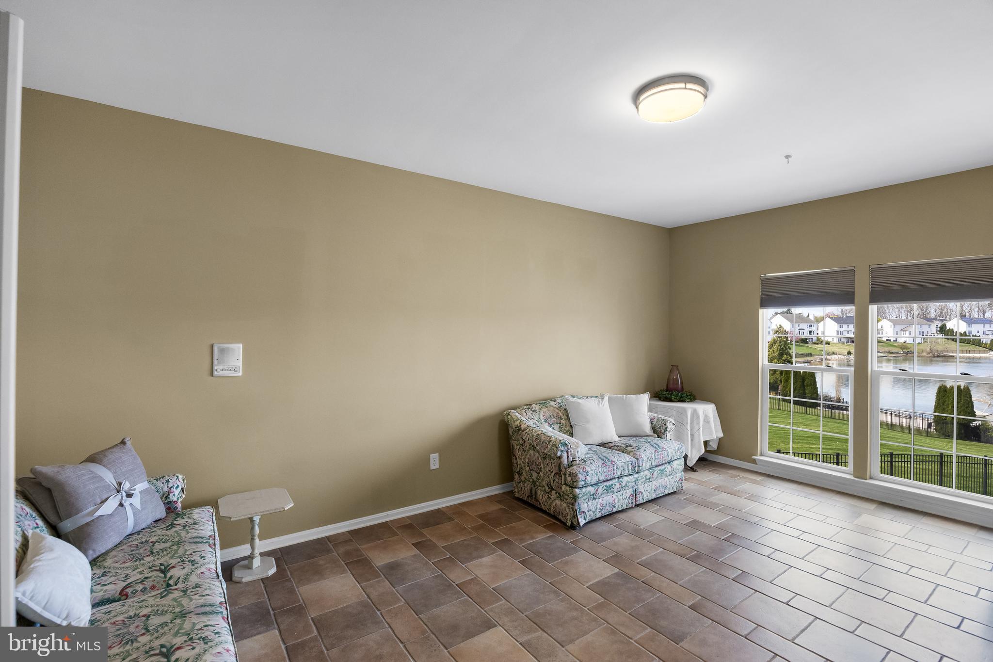 23 Mullen Drive Sicklerville, NJ 08081 - Photo 24 of 73 a living room with a couch and a floor to ceiling window