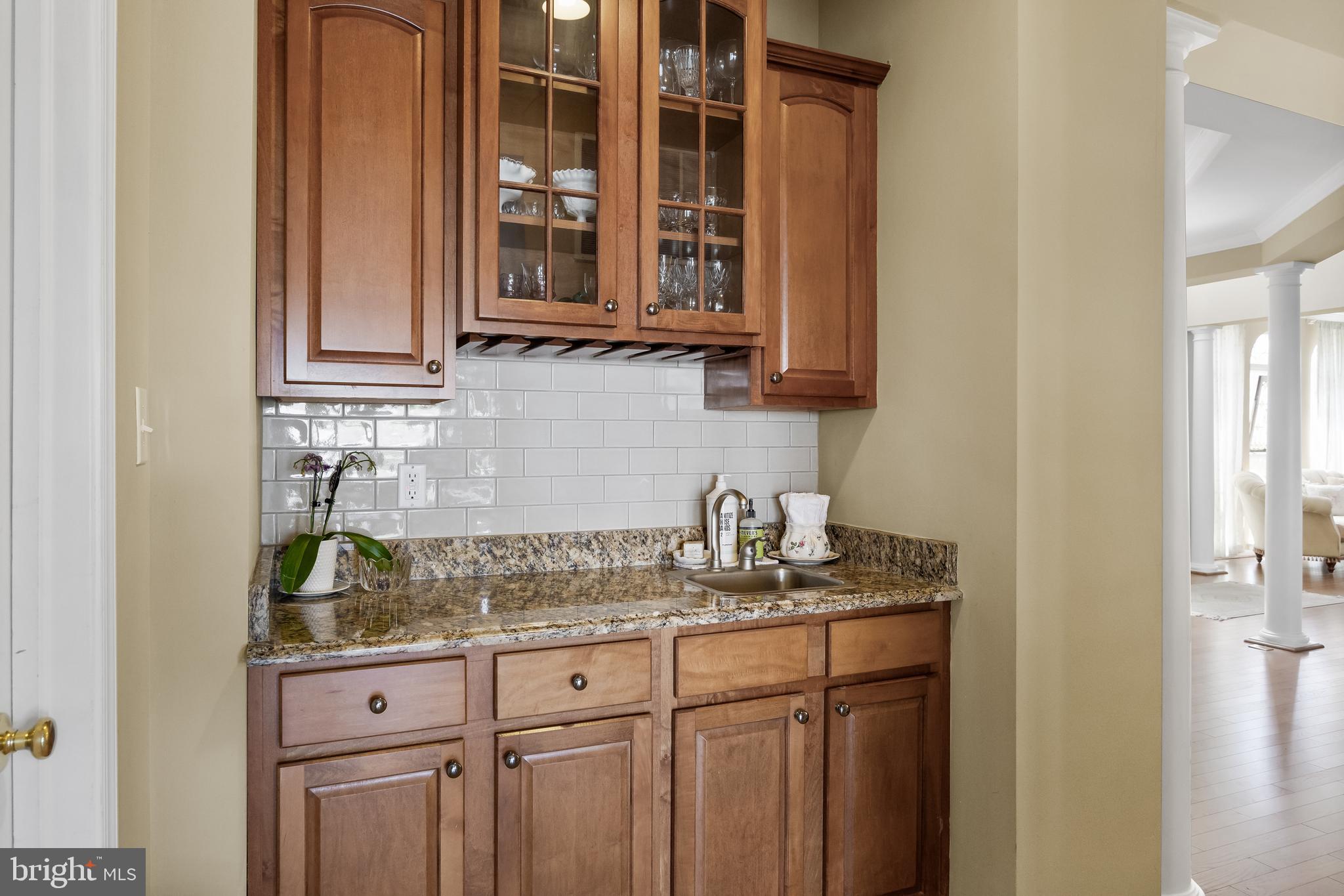 23 Mullen Drive Sicklerville, NJ 08081 - Photo 25 of 73 a kitchen with granite countertop a sink and cabinets