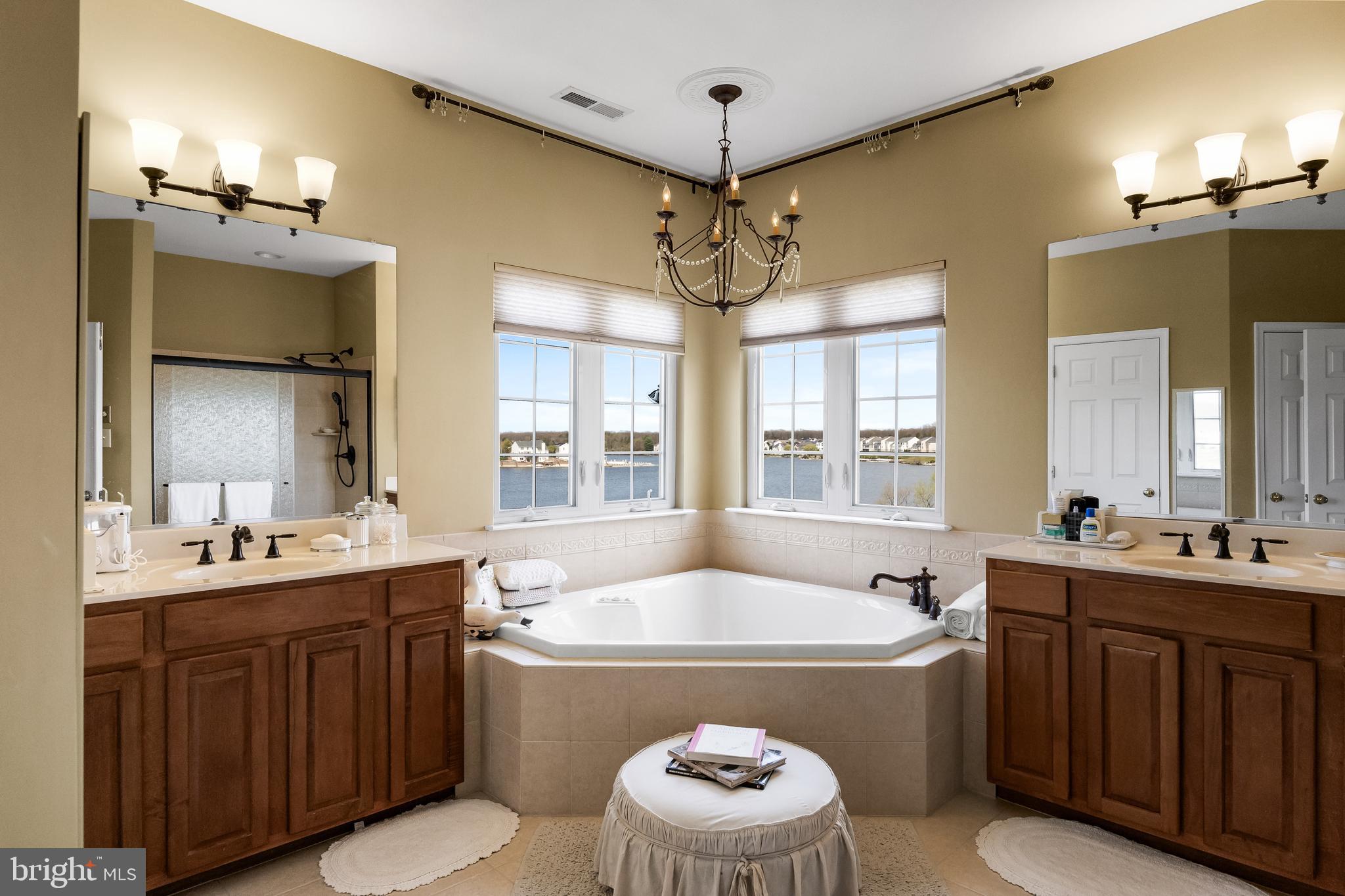 23 Mullen Drive Sicklerville, NJ 08081 - Photo 32 of 73 a bathroom with a tub sink and mirror