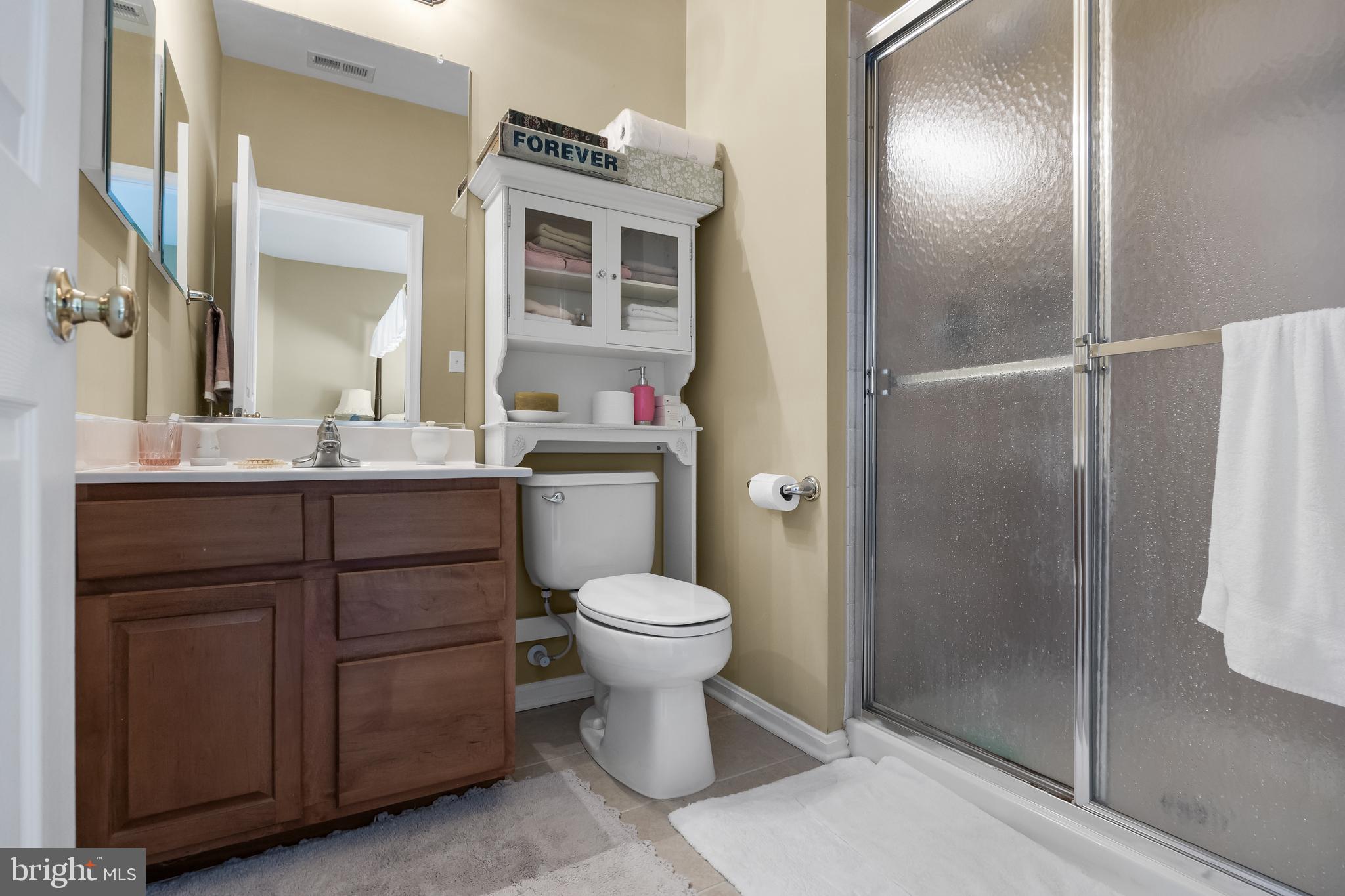 23 Mullen Drive Sicklerville, NJ 08081 - Photo 36 of 73 a bathroom with a toilet sink and shower