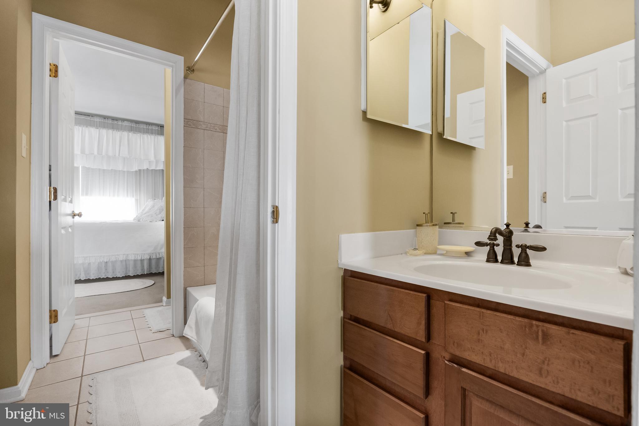 23 Mullen Drive Sicklerville, NJ 08081 - Photo 39 of 73 a bathroom with a sink and a mirror