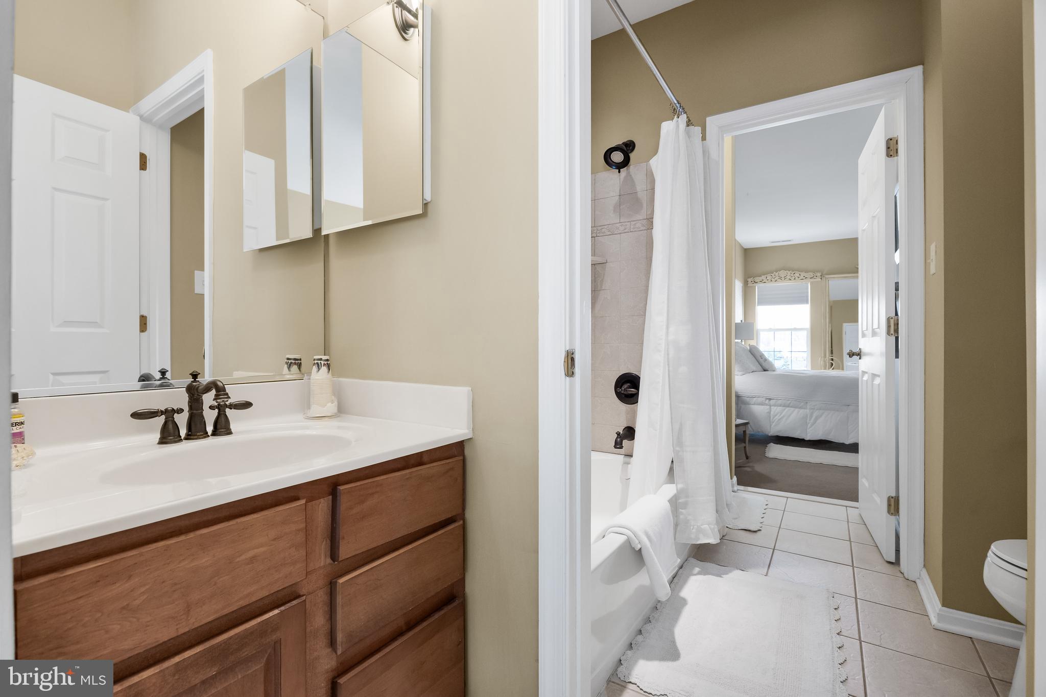 23 Mullen Drive Sicklerville, NJ 08081 - Photo 40 of 73 a bathroom with a sink a toilet and shower