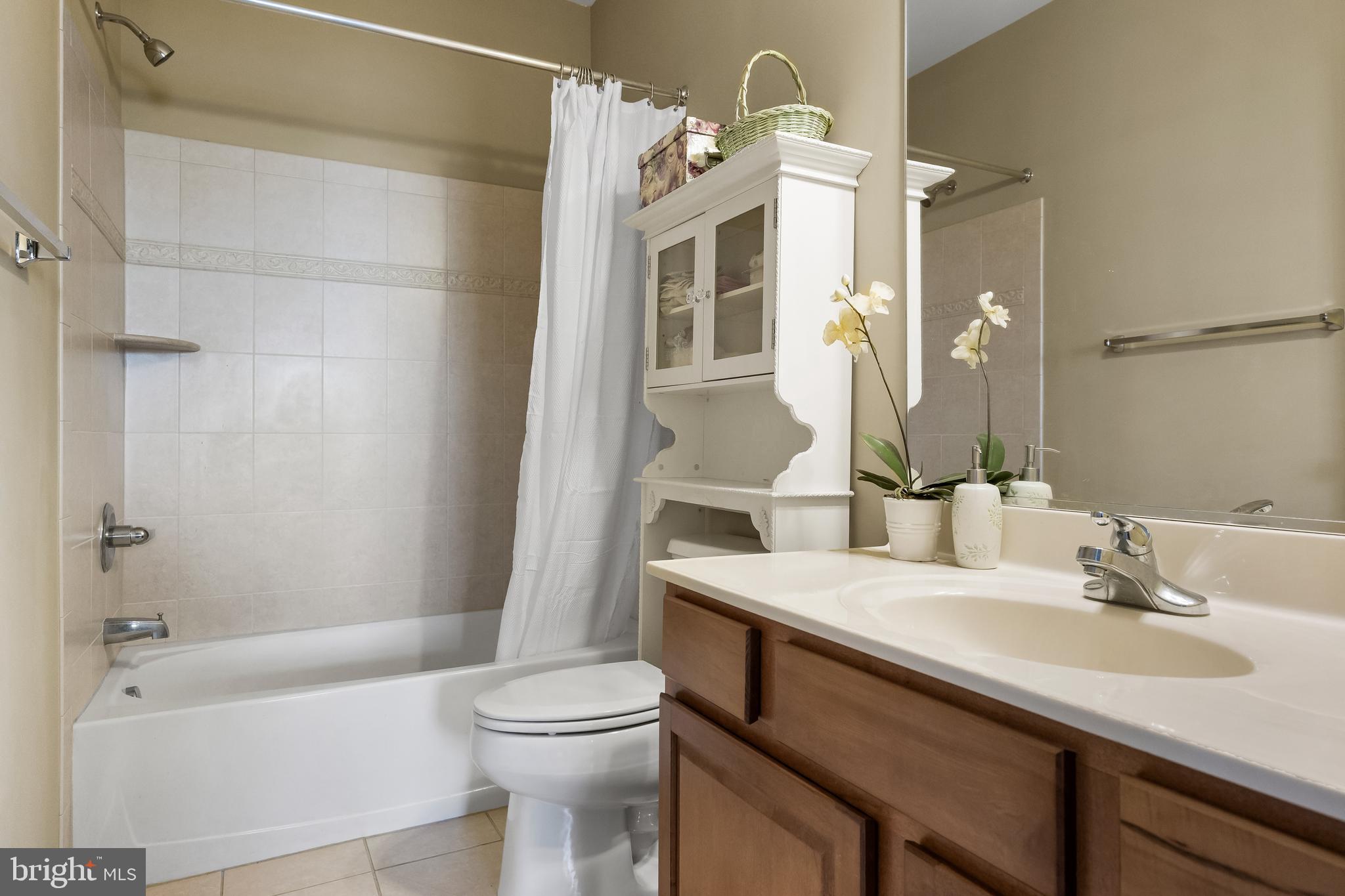 23 Mullen Drive Sicklerville, NJ 08081 - Photo 45 of 73 a bathroom with a sink a toilet and shower