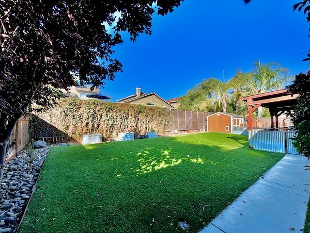 820 Talbot Drive Hollister, CA 95023 - Photo 17 of 27 a view of yard with deck and garden