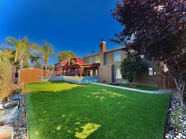 820 Talbot Drive Hollister, CA 95023 - Photo 18 of 27 a view of a house with a big yard potted plants and large tree