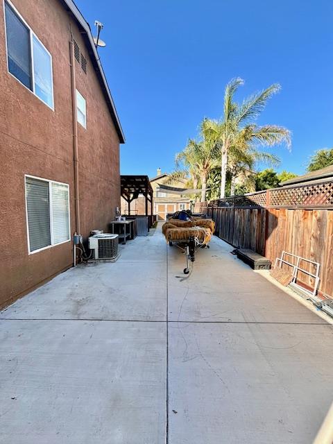 820 Talbot Drive Hollister, CA 95023 - Photo 19 of 27 a backyard of a house with barbeque oven and outdoor seating