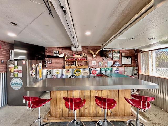 820 Talbot Drive Hollister, CA 95023 - Photo 22 of 27 a store room with stainless steel appliances kitchen island granite countertop a sink and cabinets