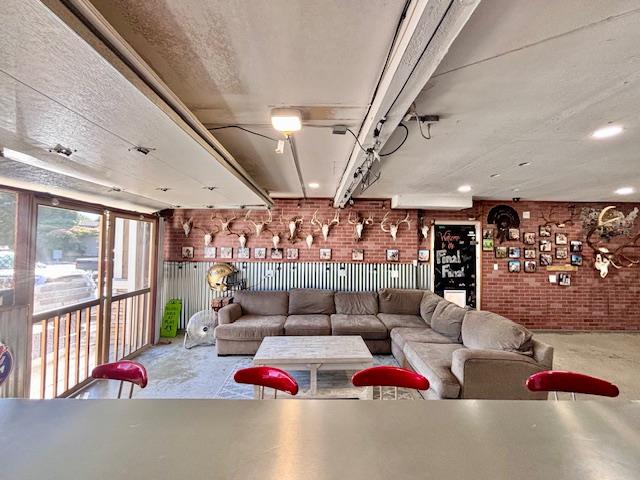 820 Talbot Drive Hollister, CA 95023 - Photo 27 of 27 a living room with lots of furniture and a chandelier