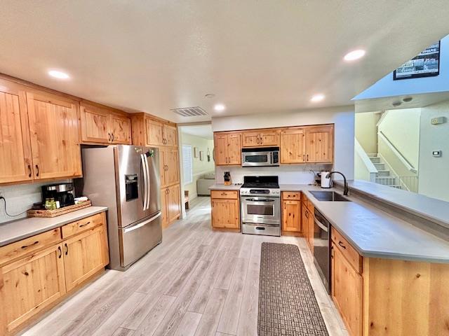 820 Talbot Drive Hollister, CA 95023 - Photo 5 of 27 a kitchen with stainless steel appliances a refrigerator sink and cabinets