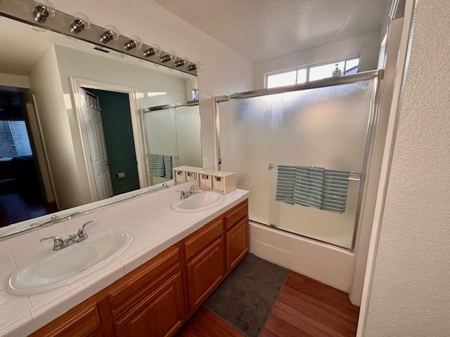 820 Talbot Drive Hollister, CA 95023 - Photo 10 of 27 a bathroom with a double vanity sink and mirror