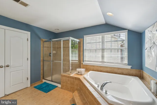 a bathroom with a tub and a sink