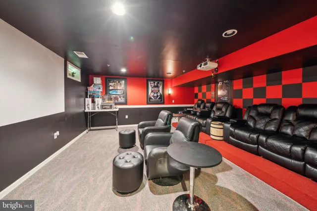 a room with furniture a air conditioner and a table