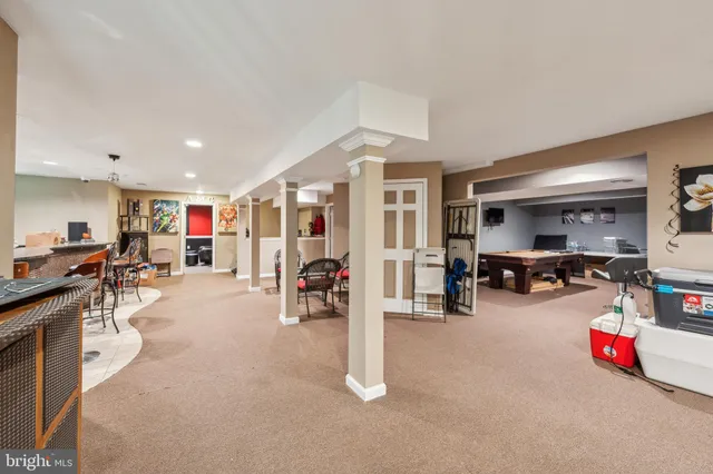 a living room with lots of furniture and gym equipment