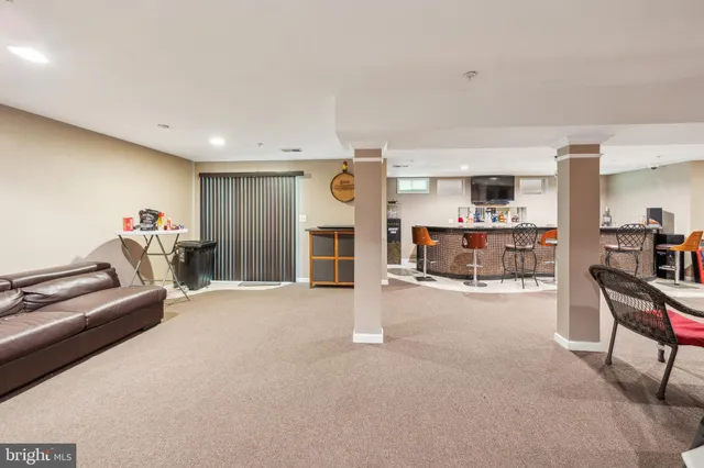a view of a livingroom with furniture and a flat screen tv