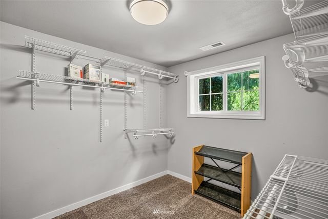 a view of a storage & utility room with racks on the wall