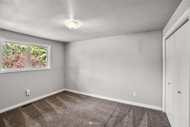 a view of a hallway with bathroom