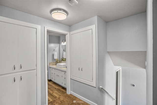 a bedroom with a bed and hallway