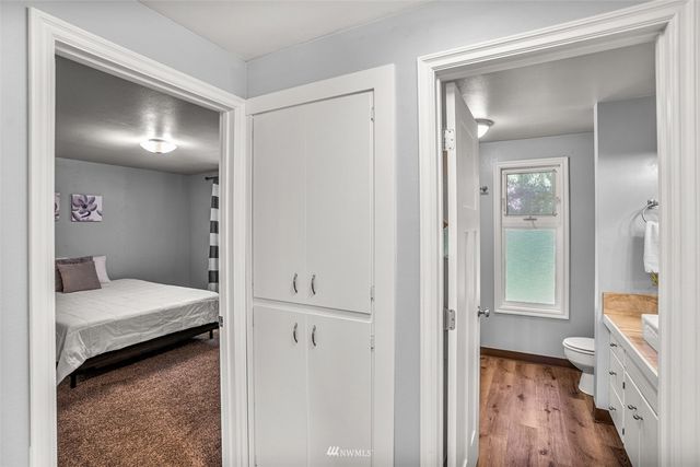 a view of entryway and hall with wooden floor