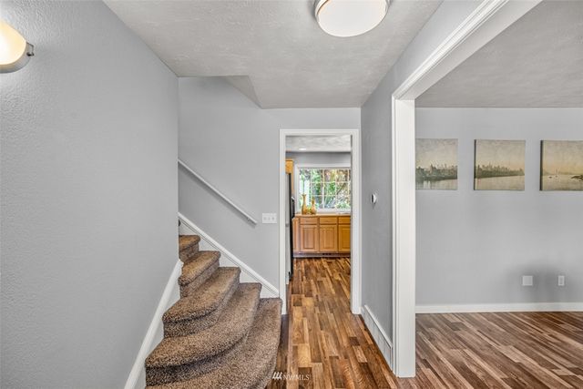 a view of entryway with wooden floor